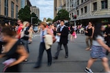 Pedestrians scramble to cross a Sydney street