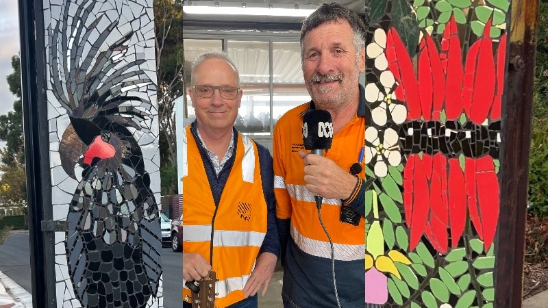 colourful mosaic artwork on poles left and right and two men in hi-vis, one with mic one with guitar in centre