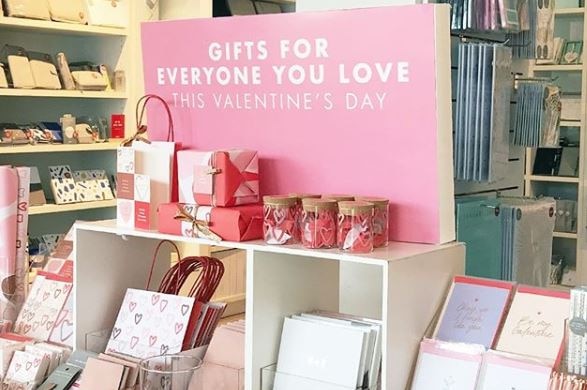 A display of notebooks and diaries for Valentines Day in a kikki.K store.