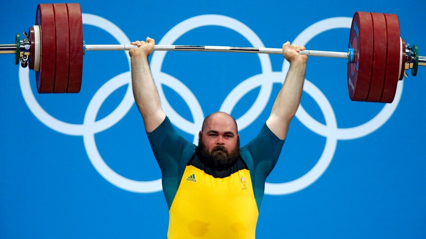 Damon Kelly lifts during the +105kg Group B clean and jerk.
