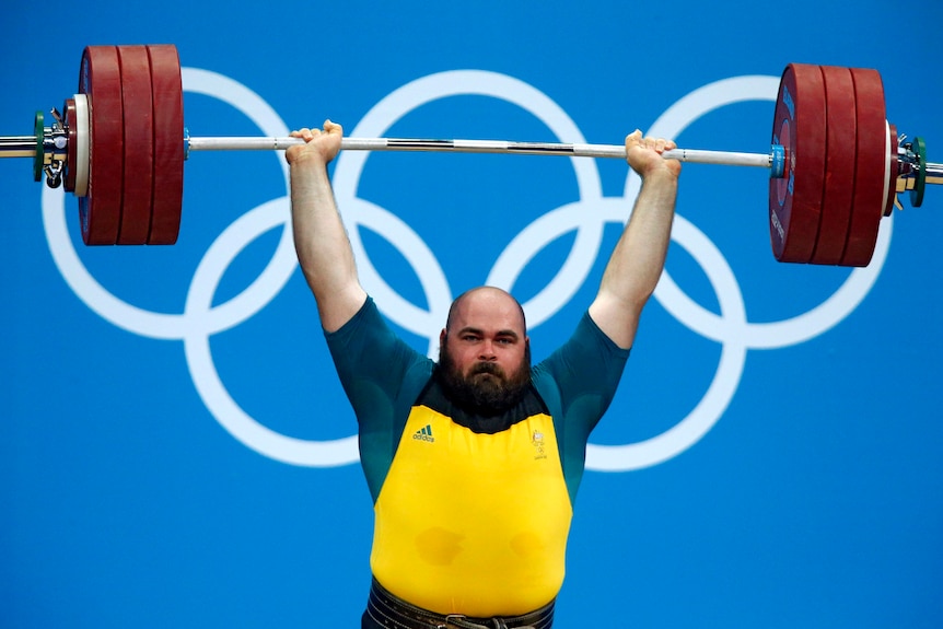 Damon Kelly lifts during the +105kg Group B clean and jerk.