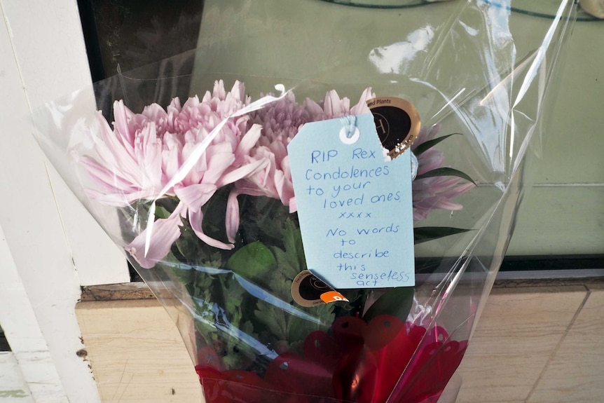 Flowers and note left for man who died.
