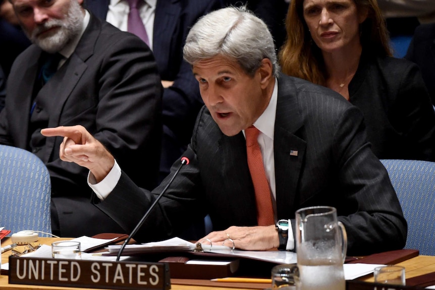 John Kerry points while speaking during a Security Council meeting.