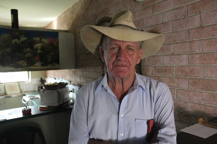 A tearful man in a living room.