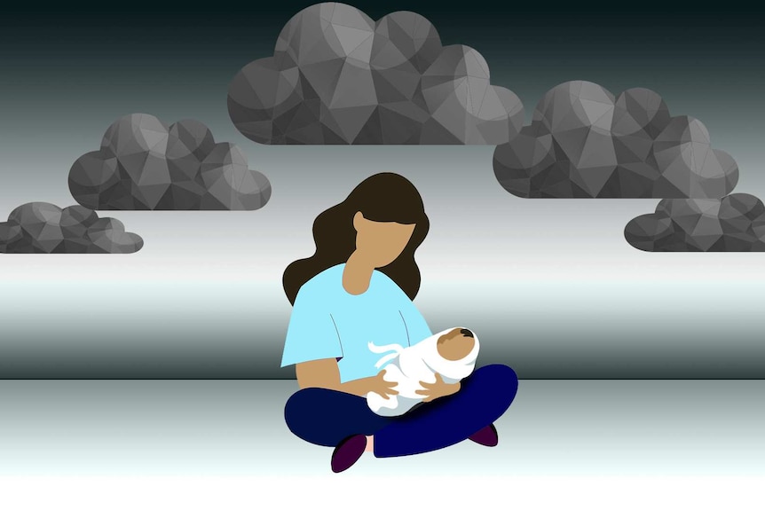 Woman holding a baby with storm clouds