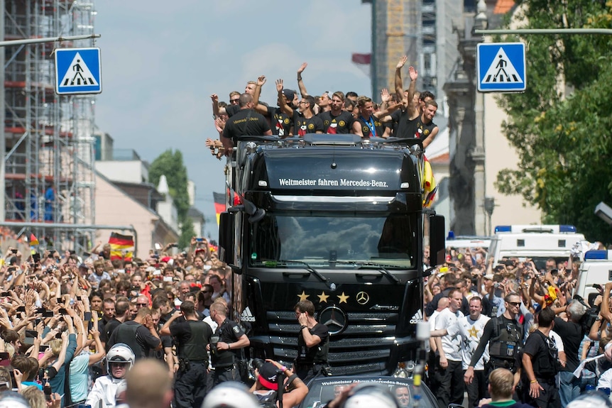German team celebrates on open top bus