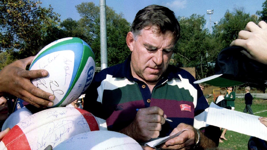 Colin Meads signs autographs