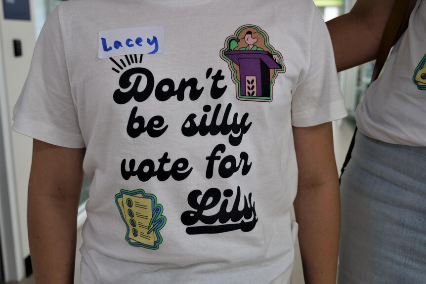 Young girl wears t shirt saying 'don't be silly vote for lily.'
