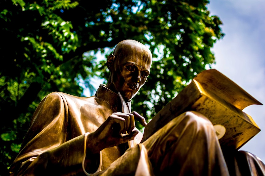 Reading man statue