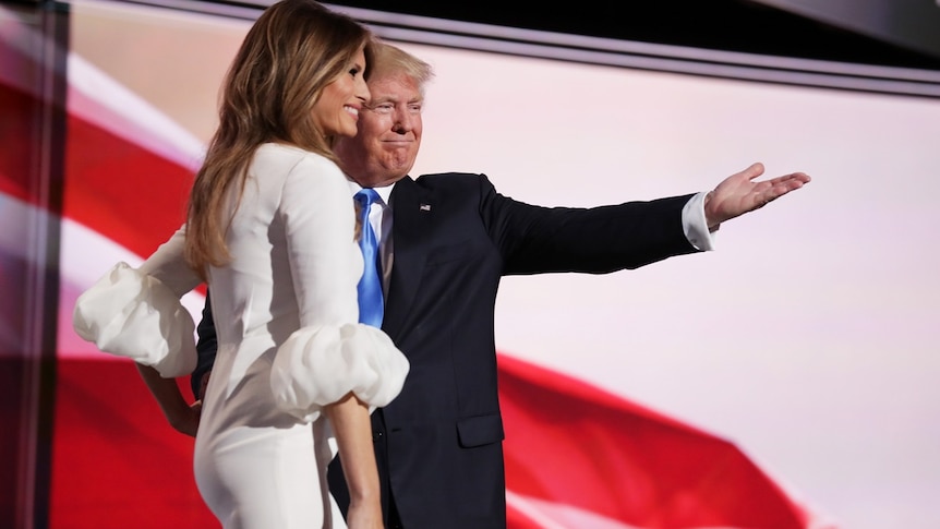 Donald Trump gestures as he introduces his wife Melania to the Republican National Convention stage.