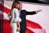 Donald Trump gestures as he introduces his wife Melania to the Republican National Convention stage.