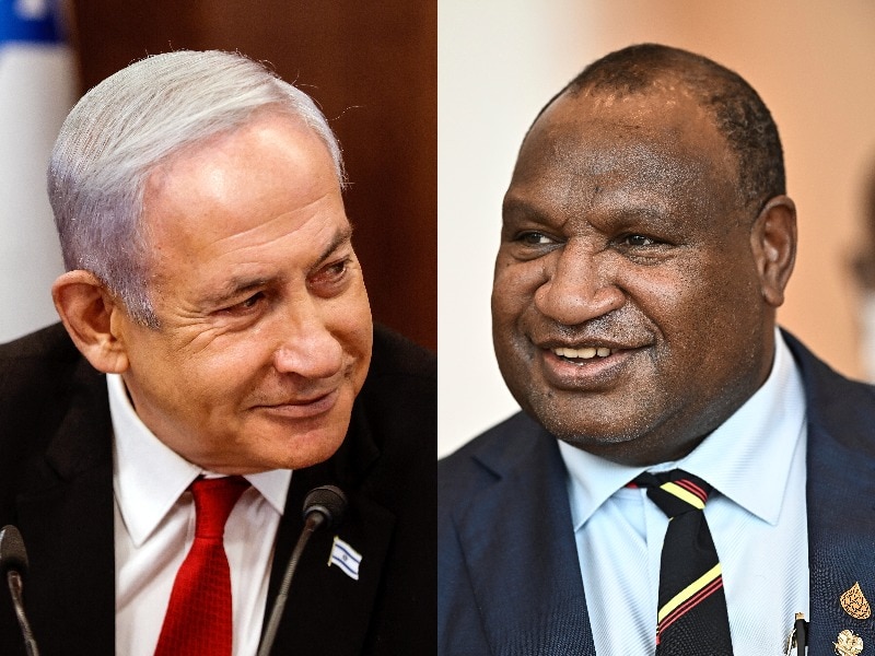 A split image shows Benjamin Netanyahu in red suit and red tie, and James Marape in navy suit and patterned tie, both smiling