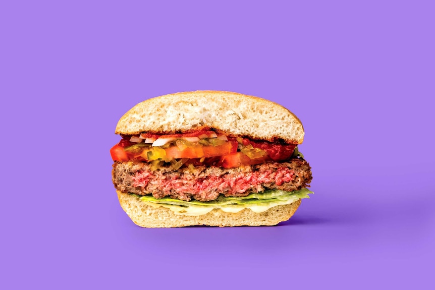 A close-up shot of a burger with a 'meat' patty that has a pink centre.