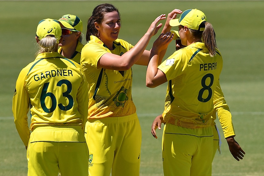 A group of Australian players celebrate a wicket during the second ODI of the Women's Ashes.