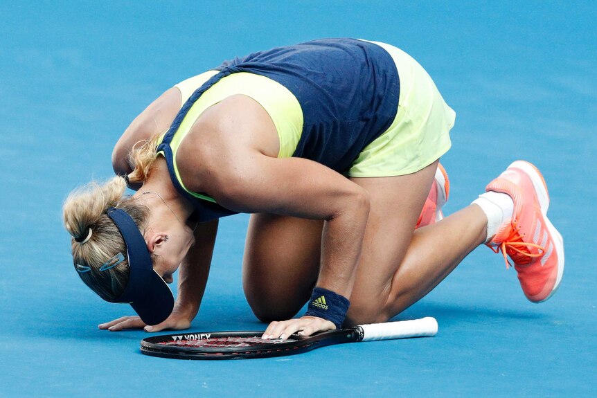 Angelique Kerber falls to her knees during her Australian Open semi-final against Simona Halep.