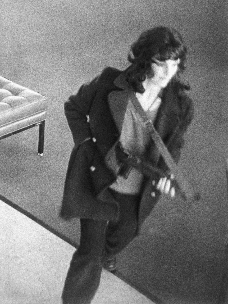 A woman holding a gun 