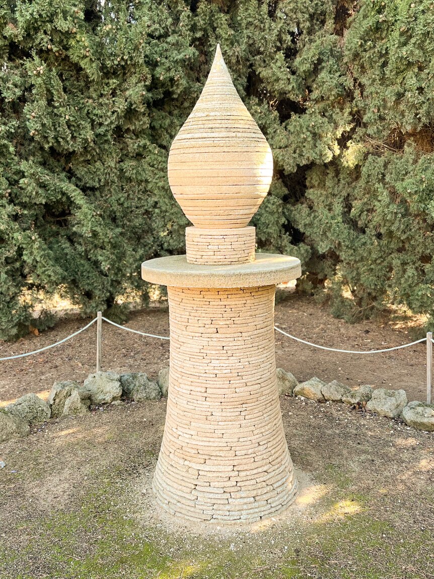 a drystone candle sculpture approx 1.5m tall