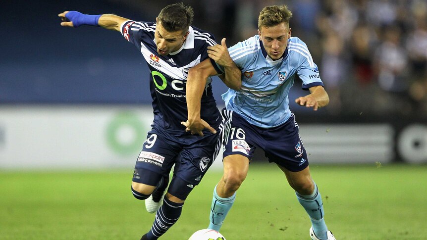 Kosta Barbarouses and Alexander Gersbach battle for possession