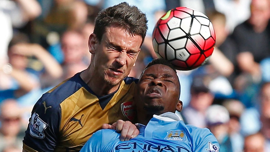 Arsenal's Laurent Koscielny goes for a header with Manchester City's Kelechi Iheanacho in May 2016.
