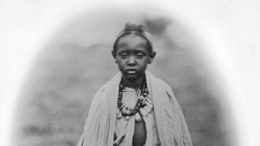 A black-and-white photo of a young boy. 