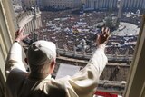 Pope Benedict XVI greets a crowd attending his weekly Angelus prayer