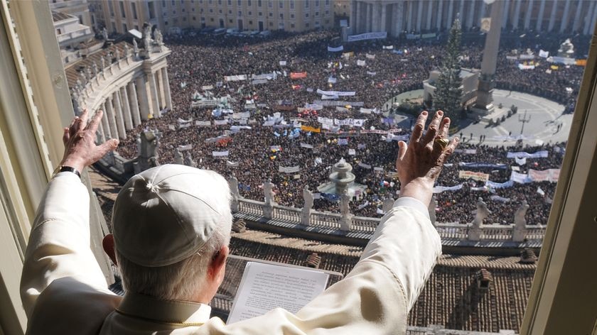 Pope Benedict XVI greets a crowd attending his weekly Angelus prayer