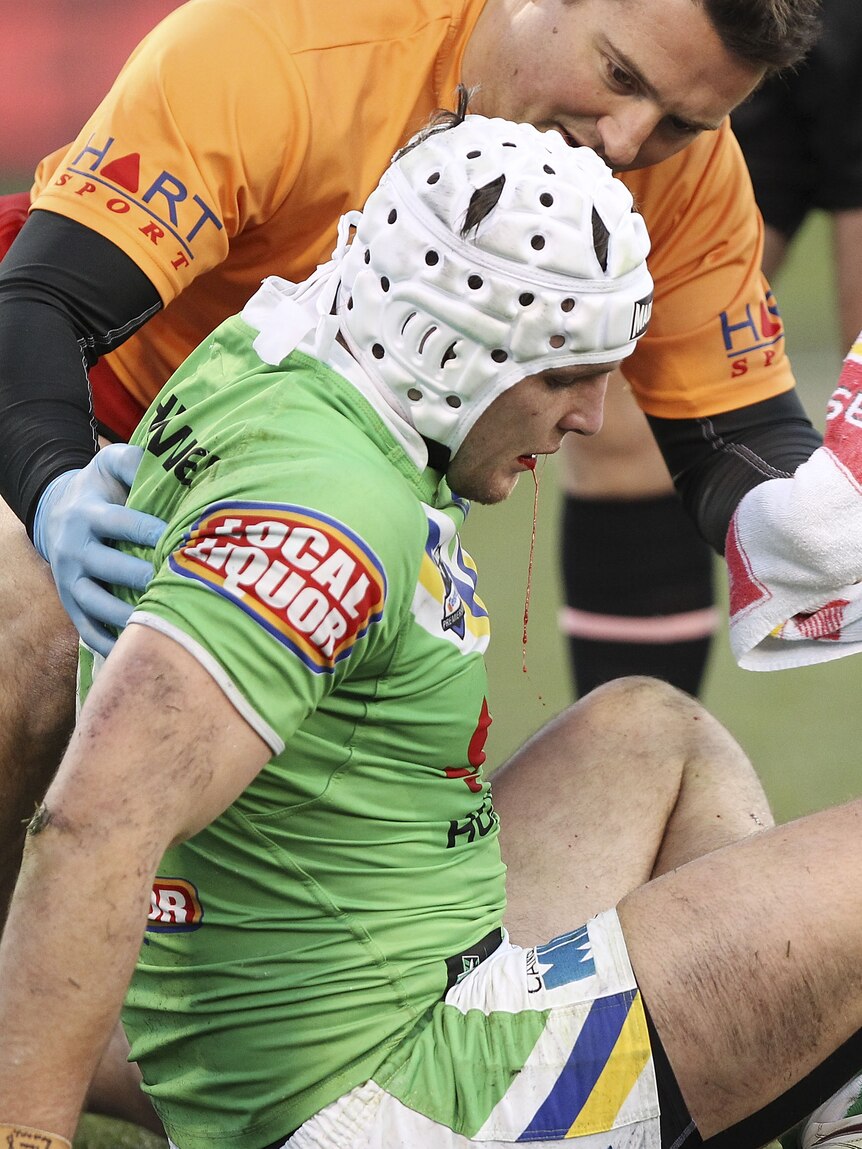 Costly injury ... Jarrod Croker receives medical attention against the Sharks