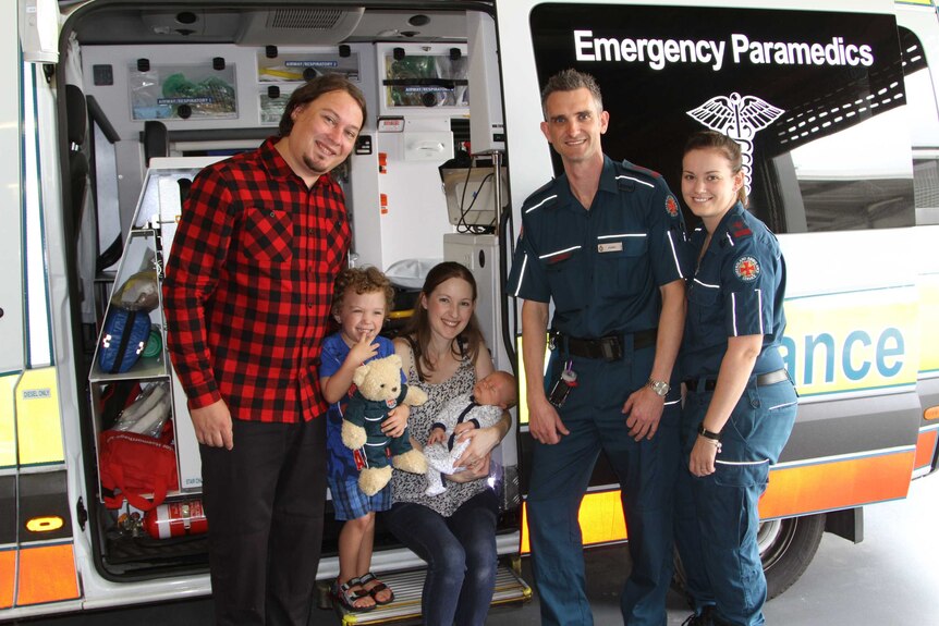 The Nobbs family with paramedics