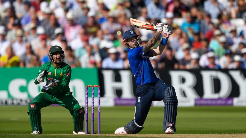 England's Alex Hales (R) hits six watched by Pakistan wicketkeeper Sarfraz Ahmed at Trent Bridge.
