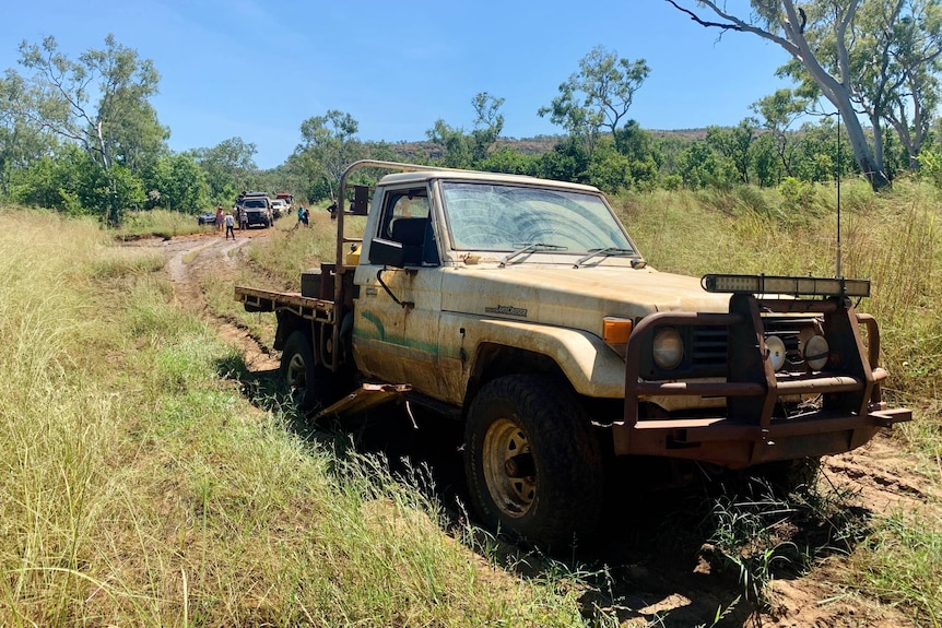 An abandoned four-wheel drive in the middle of nowhere.