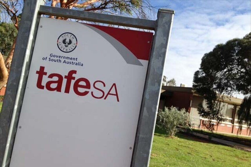 A sign reading 'TAFE SA' in front of a building and a lawn area.