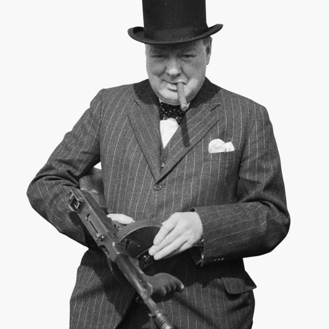 Winston Churchill examines a 'Tommy gun'