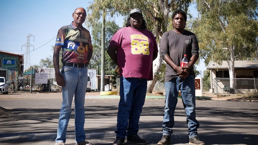 Men standing in street