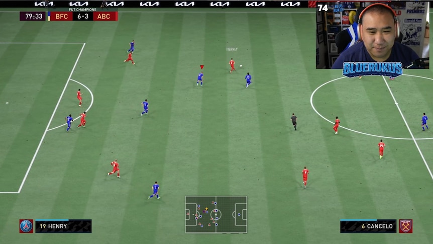 A screenshot of a soccer computer game with the player in a box in the top-right corner