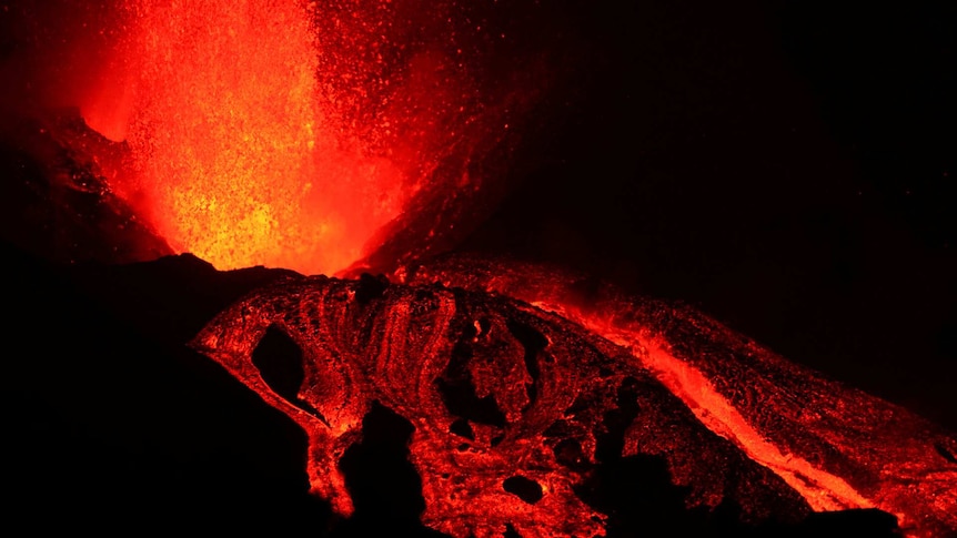 A night time shot of the lava spewing out of the La Palma Volcano