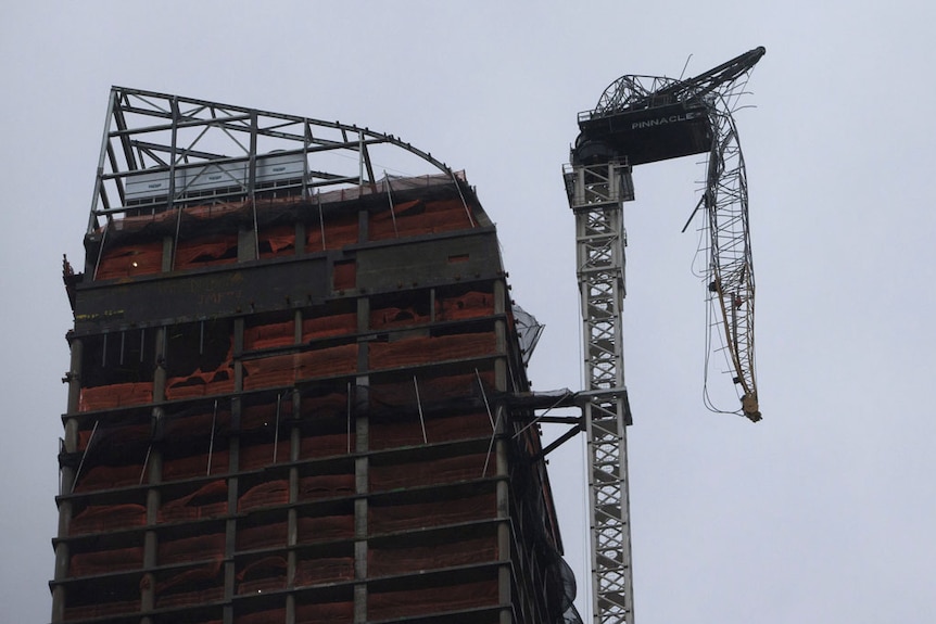 A crane on top of a New York apartment block buckles from Sandy.