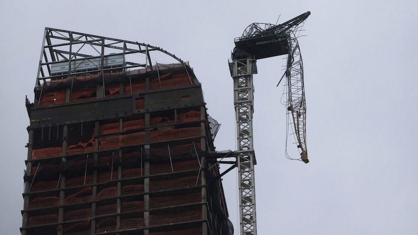 A crane on top of a New York apartment block buckles from Sandy.