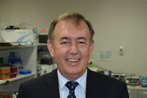 Derek Thomson, CEO of AnteoTech, stands in front of scientific equipment