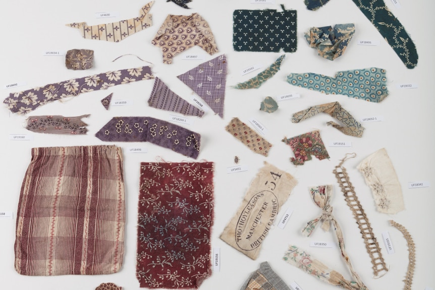 A flat-lay of scraps of fabric from the 1800s