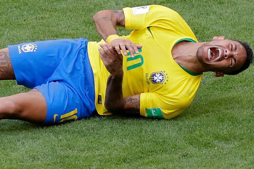 Brazil's Neymar, bottom, challenges for the ball with Mexico's Edson Alvarez at the 2018 World Cup.