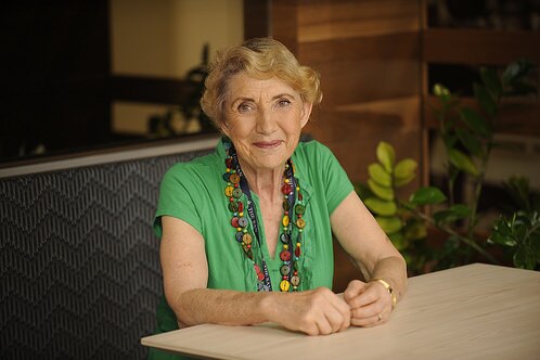 Dr Yvonne McMaster sits at a desk