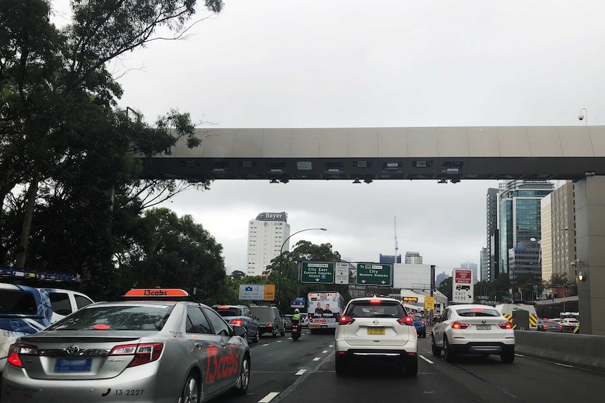 Cars driving beneath the Sydney Harbour Bridge toll point