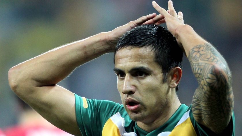 Tim Cahill reflects after missing the target against Serbia.