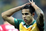 Tim Cahill reflects after missing the target against Serbia.