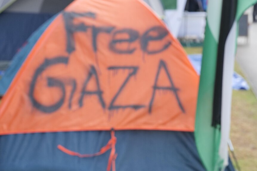 A tent spraypainted with the words "Free Gaza" on the grounds of the University of Sydney