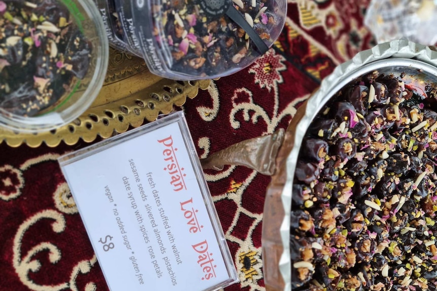 Photograph of a plate of stuff dates on carpet.