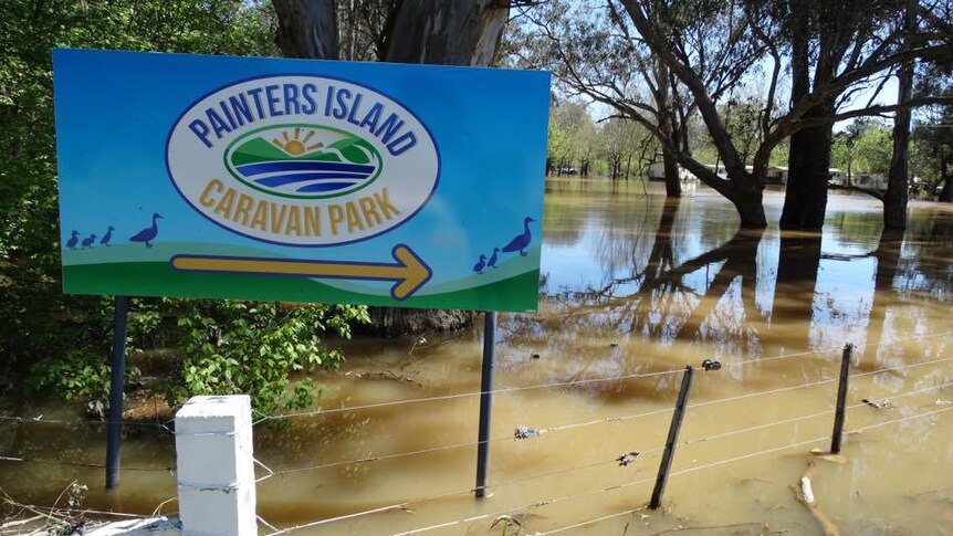 Sign for flooded Painters Island Caravan Park