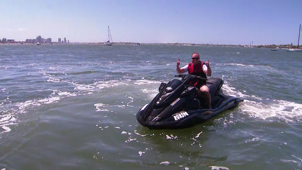 Steven Miles rides a jetski on the Gold Coast - ABC News