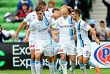 Melbourne City's Aaron Mooy celebrates after converting penalty against Brisbane Roar