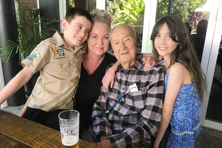 John with his daughter and two grandchildren.